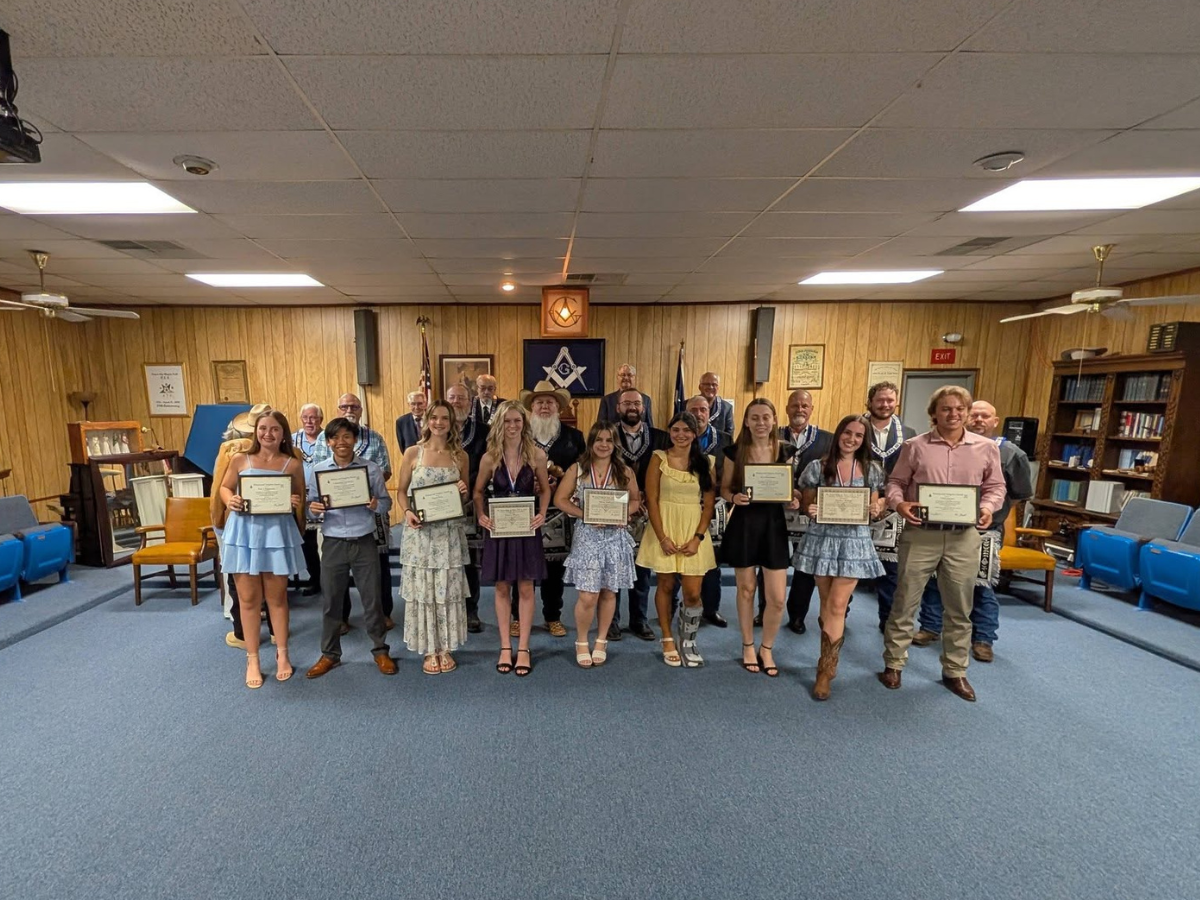 Lamar Scholarship recipients with lodge officers in the League City Lodge room.